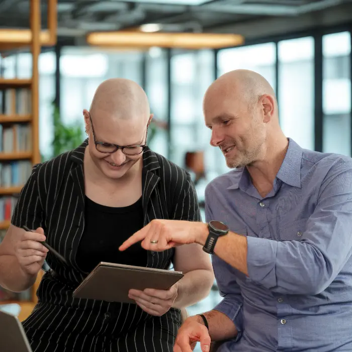 Micah Mitchell and Jared Mitchell dressed in business attire